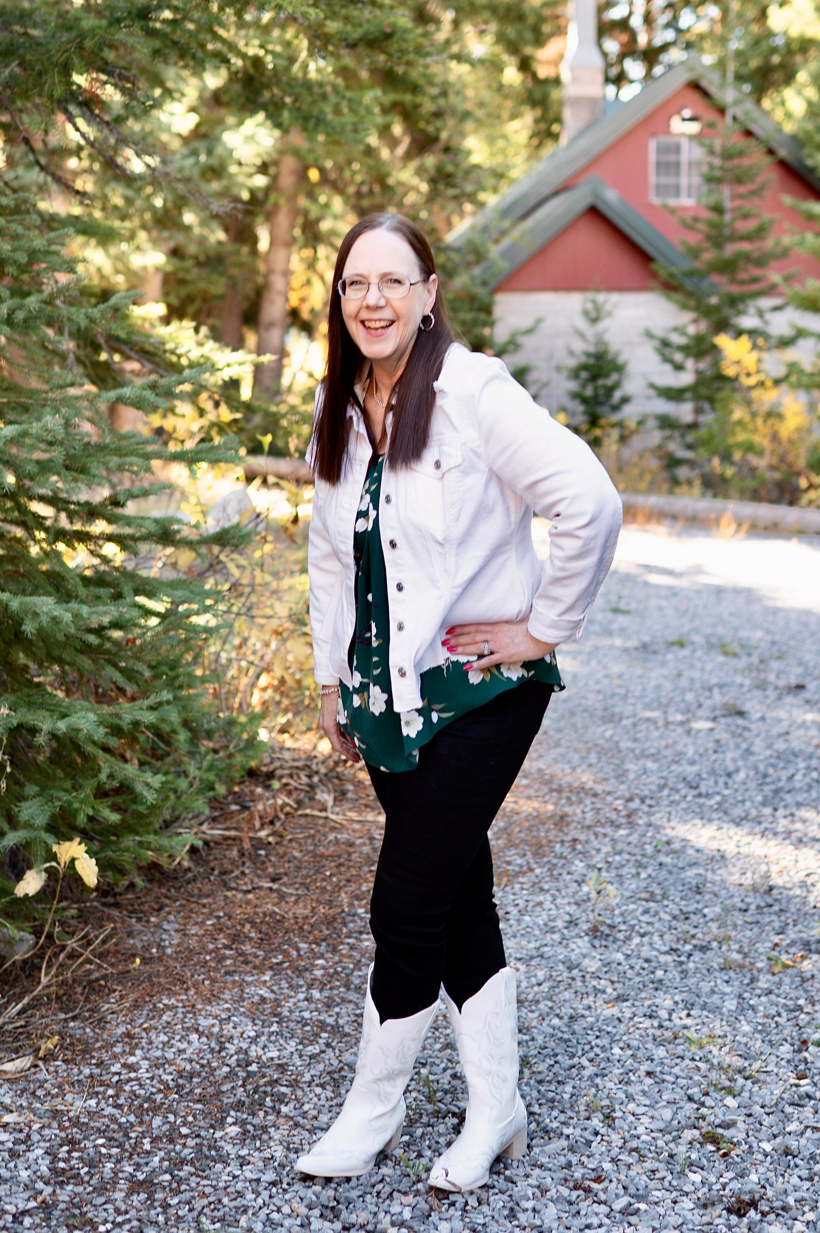 Midlife happy woman in cowboy boots. 