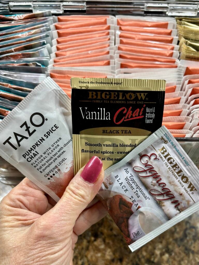 Tazo and Bigelow tea bags with a tea bag storage box