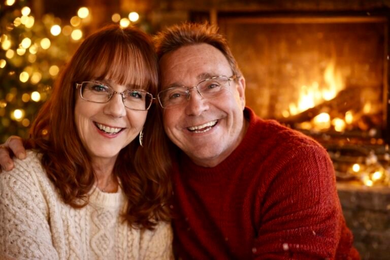 Husband and wife sitting cozy by the fire.
