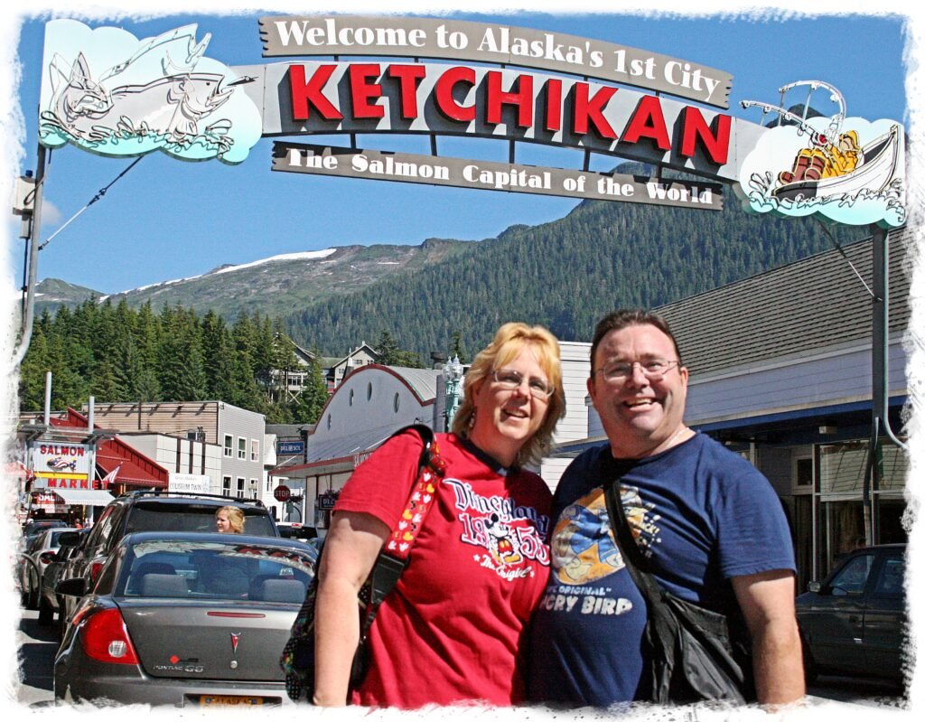 Happy couple visiting Ketchikan, Alaska while on an Alaskan cruise.