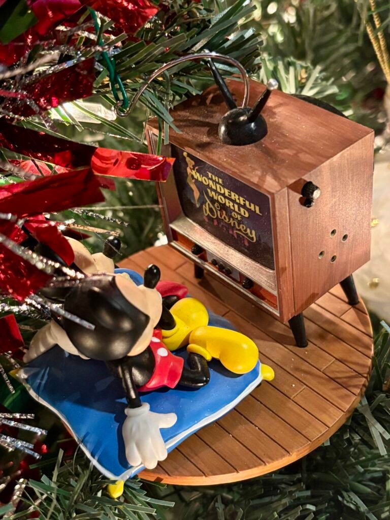 World of Disney Mickey & Minnie Christmas ornament on a Christmas tree.