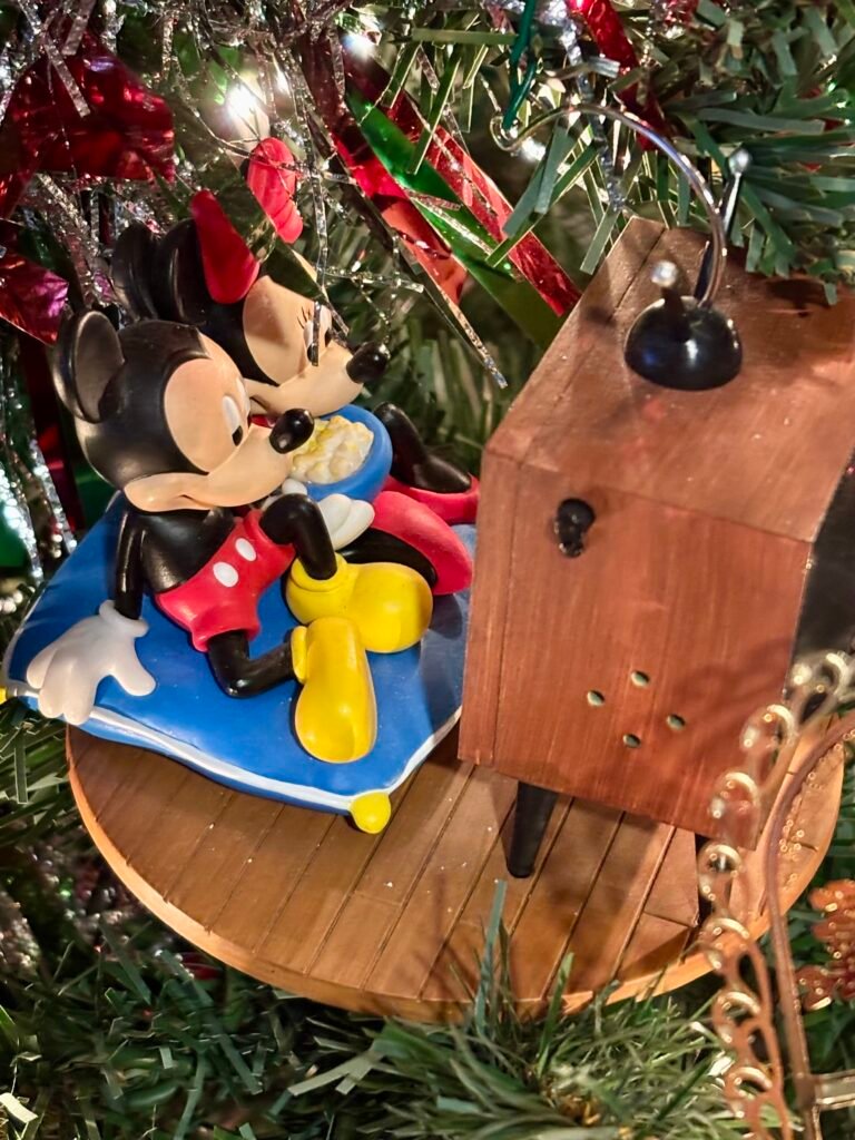 World of Disney Mickey & Minnie Christmas ornament on a Christmas tree.
