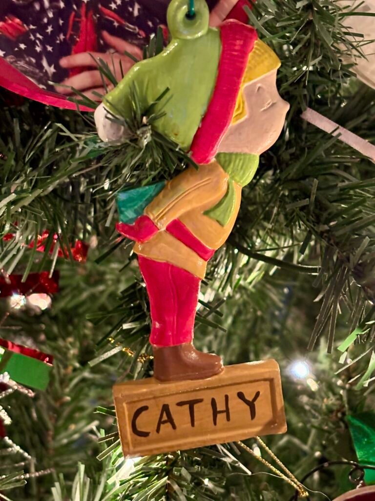 Vintage Christmas ornament of a girl named Cathy from 1979. 
