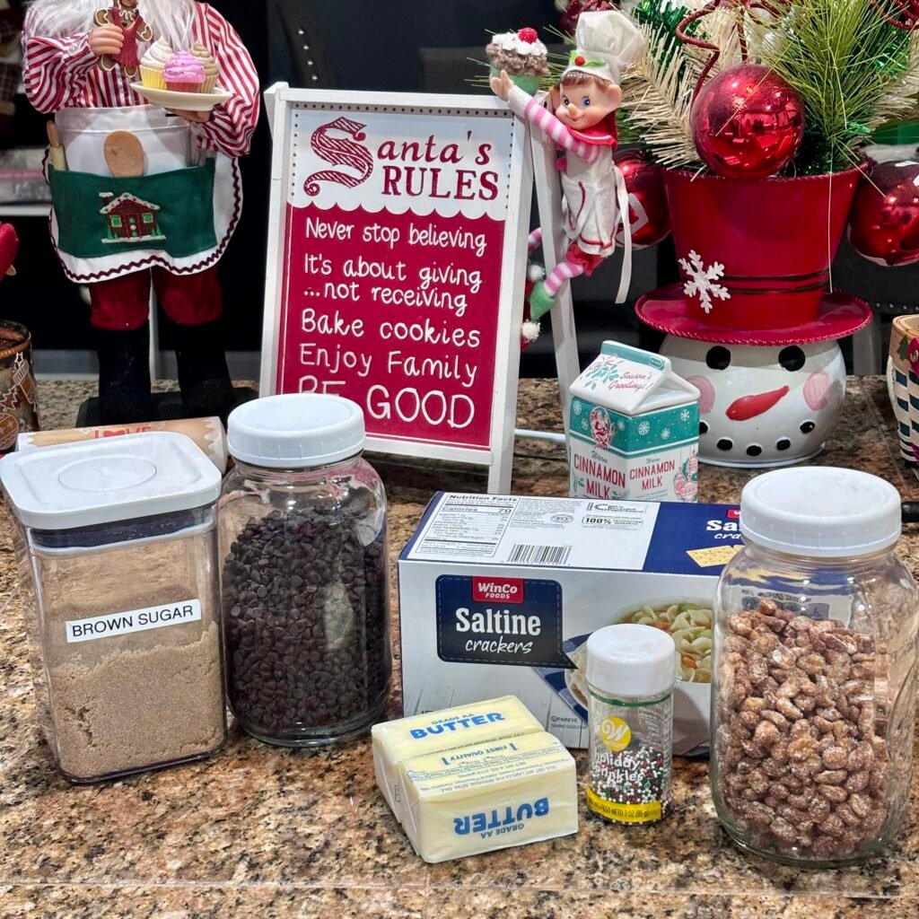 Ingredients for Christmas crack including saltines butter brown sugar chocolate chips peanuts and sprinkles