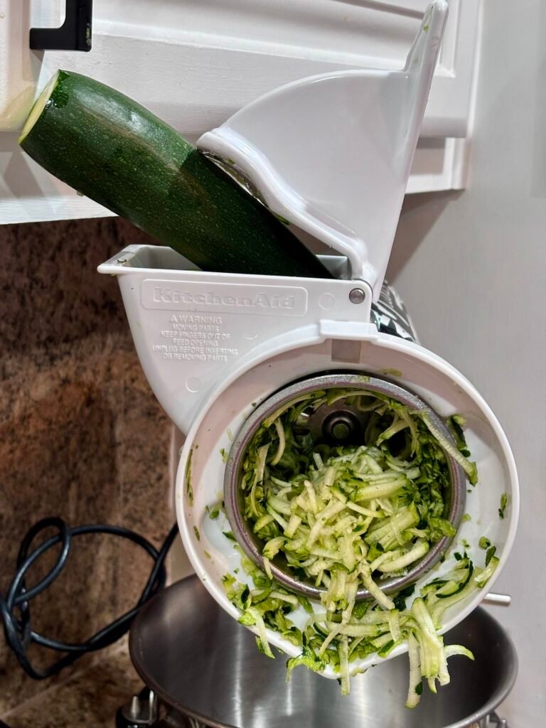 There are a few kitchen habits that make cooking feel easier instead of overwhelming—and this is one of mine. When zucchini is in season and on sale, I grab a bunch, shred it all at once, and freeze it in recipe-ready portions. It takes about 20 minutes start to finish, saves money, and makes it incredibly easy to add vegetables to baking, dinners, and quick meals later on. If you’ve ever bought zucchini with good intentions… only to find it sad and forgotten in the crisper drawer—this is for you.