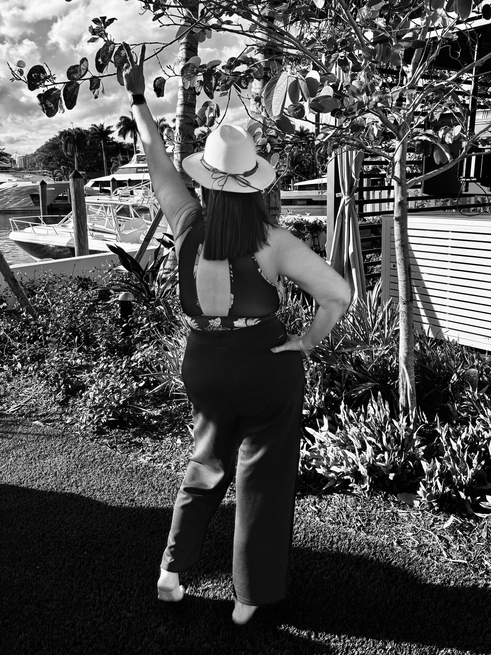 Strong and confident woman pointing to the sky. 