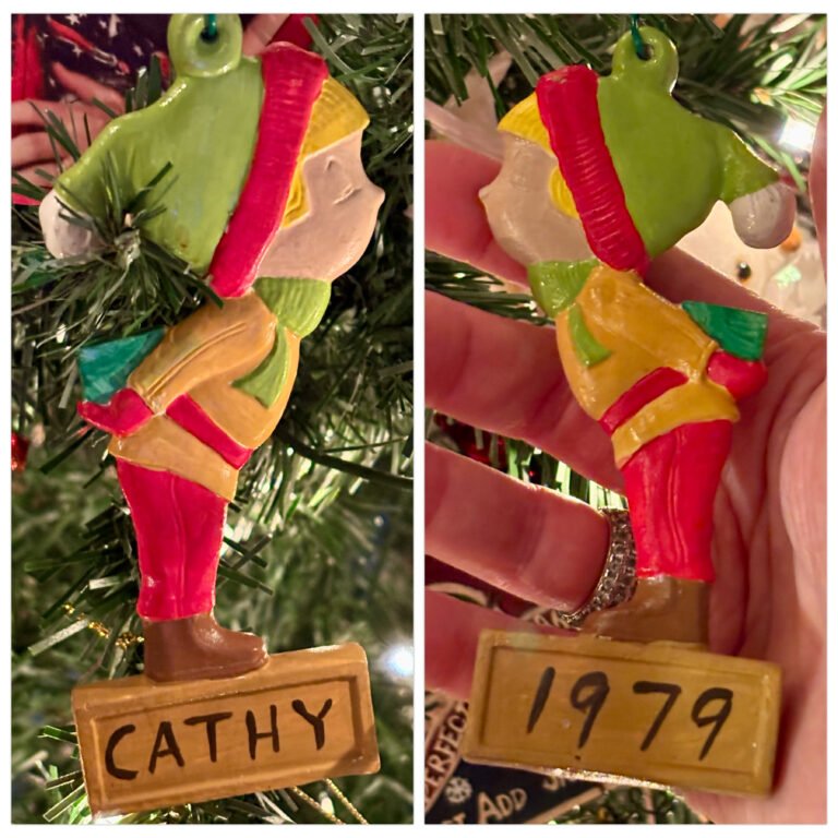 Vintage ceramic Christmas ornament from 1979 of a girl named Cathy.