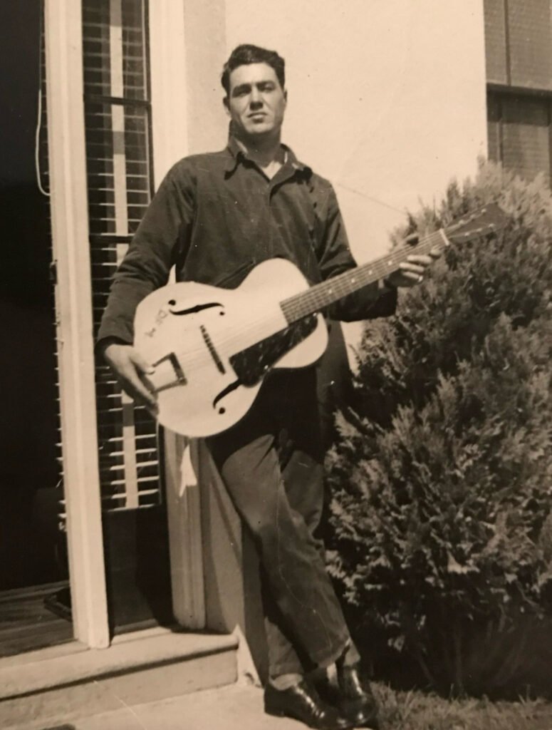 My grandpa during his Hollywood years, playing guitar.