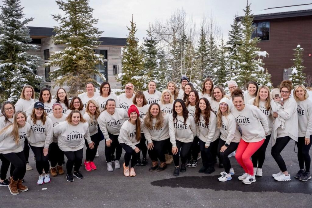 Group of women friends together in the snow during the winter. 