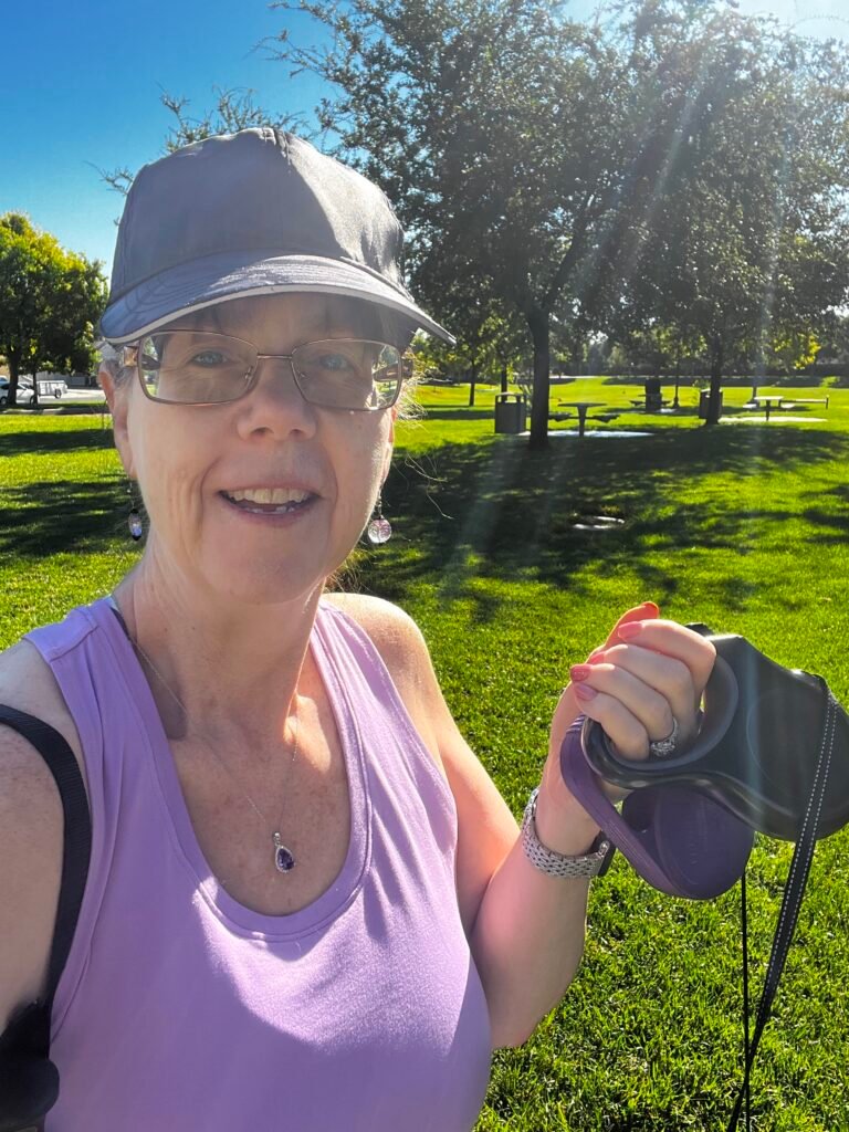 Midlife woman walking her dogs